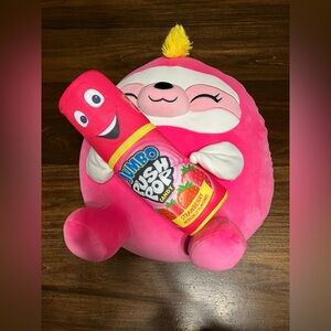 Zuru Snackles 14” Susie the Sloth plush toy holding a Push Pop Strawberry Candy